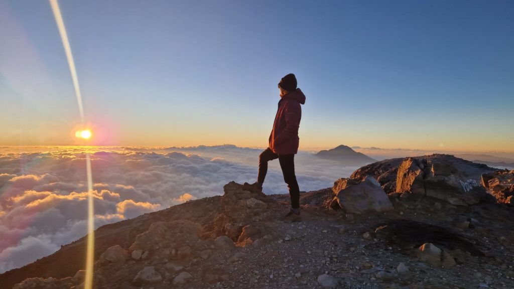 Tajumulco volcano hike in guatemala hiker on top of mountain