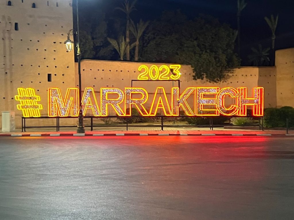 hashtag marrakech sign lit up at night