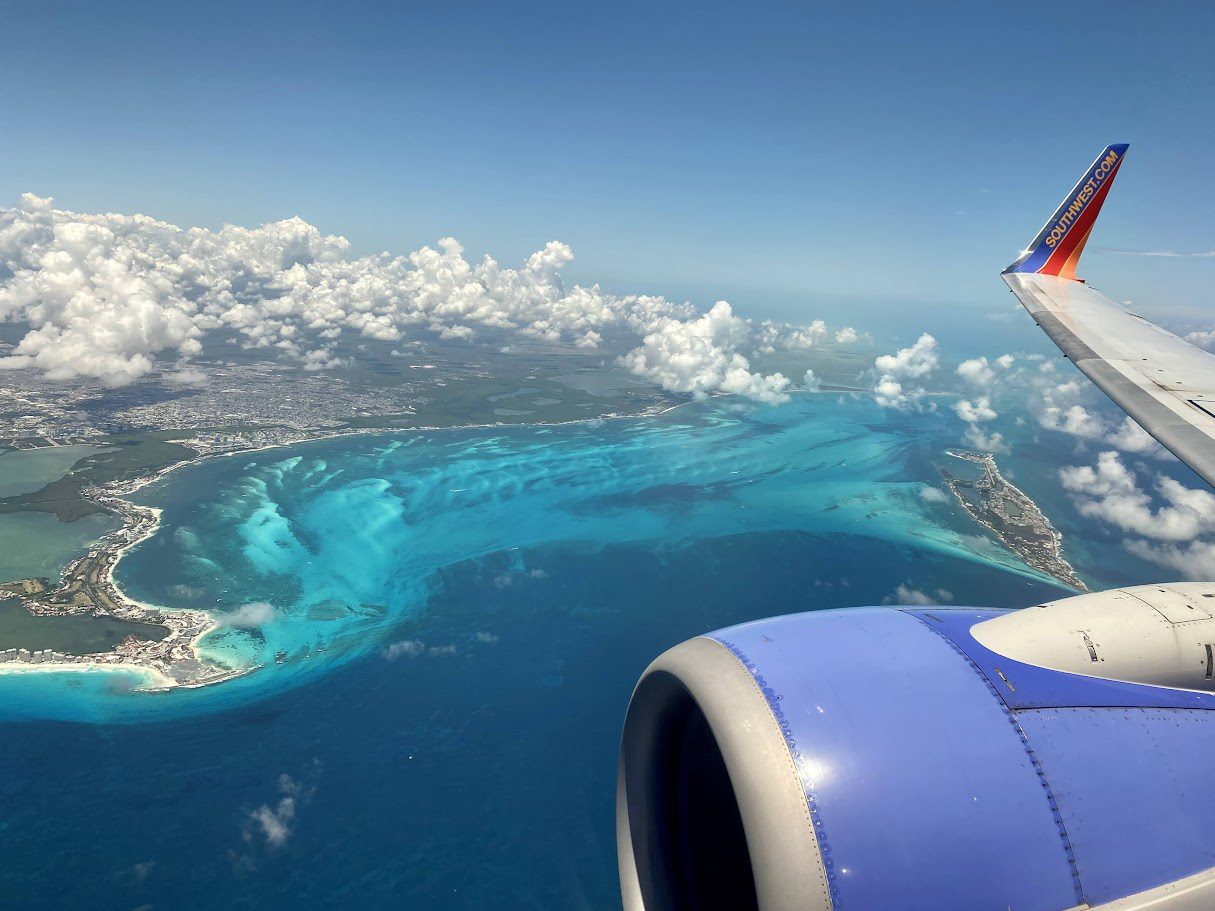 southwest plane flying over tropical island